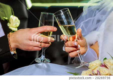 Womans and mans wedding hands with glasses. Womans and mans wedding hands with glasses. 28269736