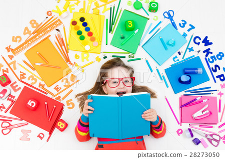 Child with school and drawing supplies 28273050