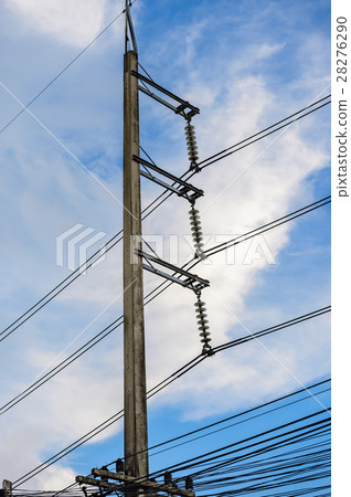 Old electricity post against blue sky with cloud Old electricity post against blue sky with cloud 28276290