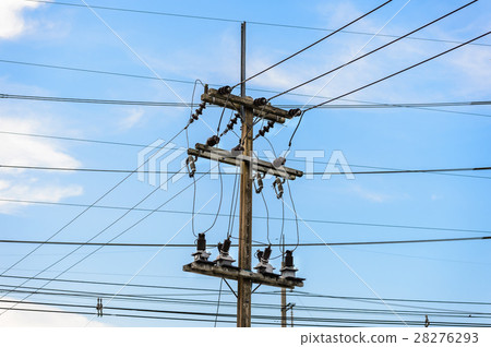 Old electricity post against blue sky with cloud Old electricity post against blue sky with cloud 28276293