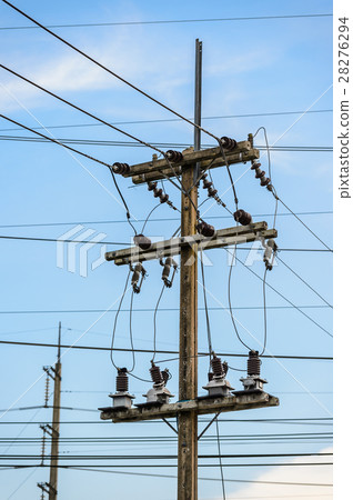 Old electricity post against blue sky with cloud Old electricity post against blue sky with cloud 28276294
