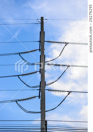 Old electricity post against blue sky with cloud 28276295