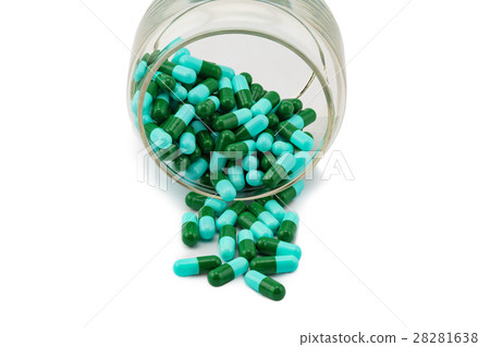 Antibiotic capsule spilling out of a glass bottle Antibiotic capsule spilling out of a glass bottle 28281638