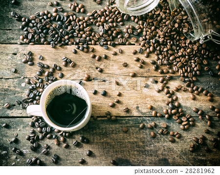 Coffe beans on the grunge wood with cup. 28281962