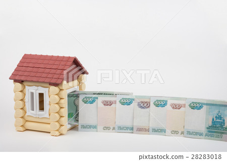Before the doors open toy house lined up Russian rubles banknotes of different denomination Before the doors open toy house lined up Russian rubles banknotes of different denomination 28283018