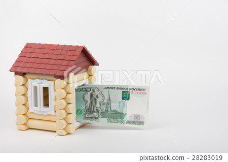 From toy house door sticks banknote thousand Russian rubles 28283019