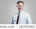 Attractive business man portrait on gray 28283462