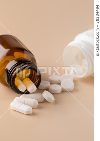 Glass and plastic pills bottle 28284494