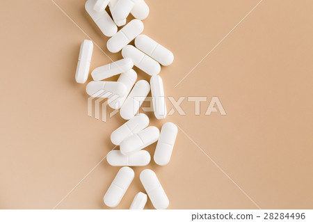 Pile of white pills Pile of white pills 28284496