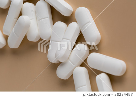 Pile of white pills Pile of white pills 28284497