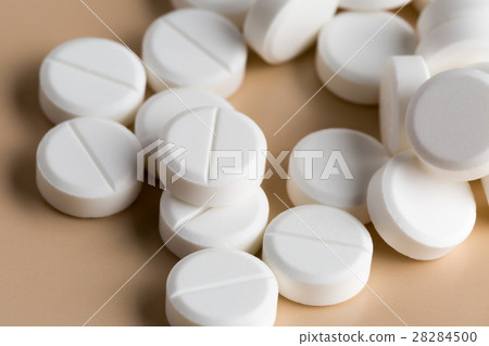 Heap of round white pills Heap of round white pills 28284500