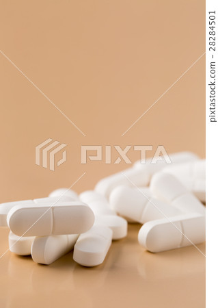 Pile of white pills Pile of white pills 28284501