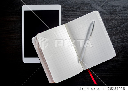 Notebook with red bookmark on a table Notebook with red bookmark on a table 28284628