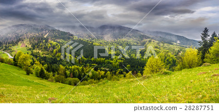 meadow with trees in mountains at sunset meadow with trees in mountains at sunset 28287751