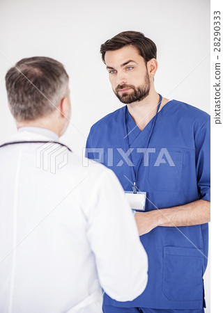 Serene doctors speaking in clinic Serene doctors speaking in clinic 28290333