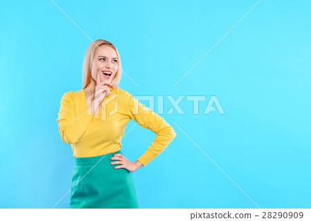 Cheerful young woman coming up with something Cheerful young woman coming up with something 28290909