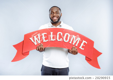 Friendly guy greeting long expected guest Friendly guy greeting long expected guest 28290915