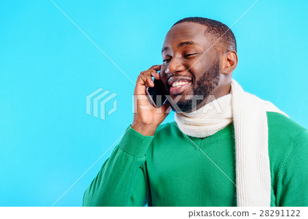 Joyful man communicating on mobile phone Joyful man communicating on mobile phone 28291122