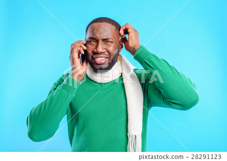 Nervous guy talking on smartphone Nervous guy talking on smartphone 28291123
