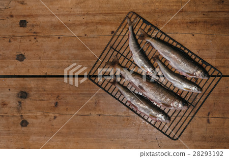 Fresh fish before cooking on the grill. Fresh fish before cooking on the grill. 28293192