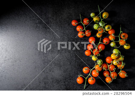 Fresh cherry tomatoes on black wooden background 28296504