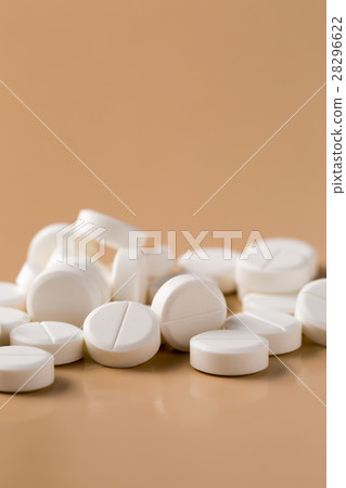 Heap of round white pills Heap of round white pills 28296622