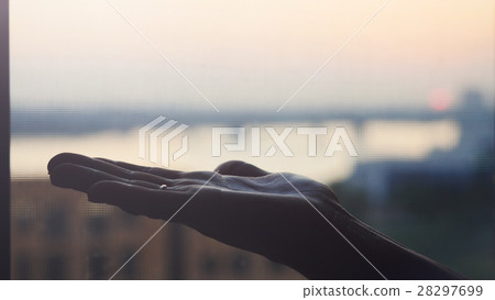 Female hand on blurred city background 28297699