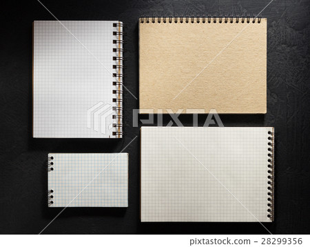 notebook on black background notebook on black background 28299356