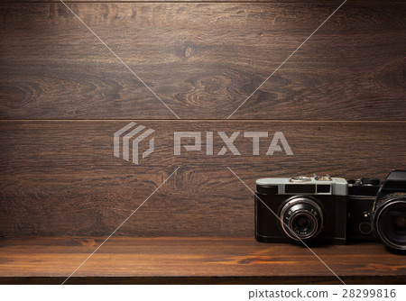 old camera at shelf wall wood 28299816