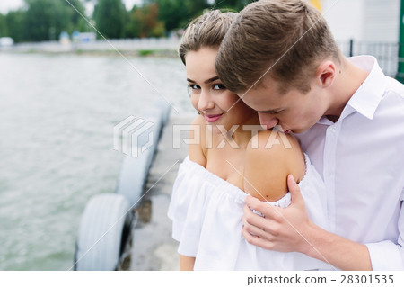 man and woman posing on the lake man and woman posing on the lake 28301535