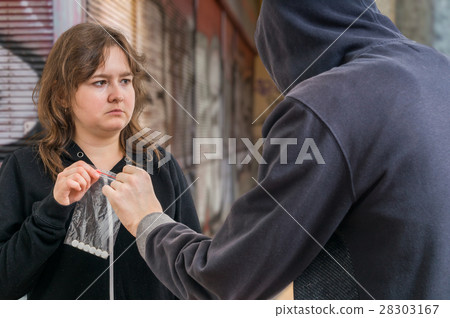 Woman is taking white pills from drug dealer. Woman is taking white pills from drug dealer. 28303167