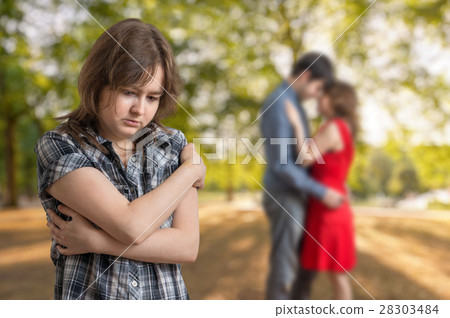 Jealousy girl seeing her boyfriend with other girl 28303484