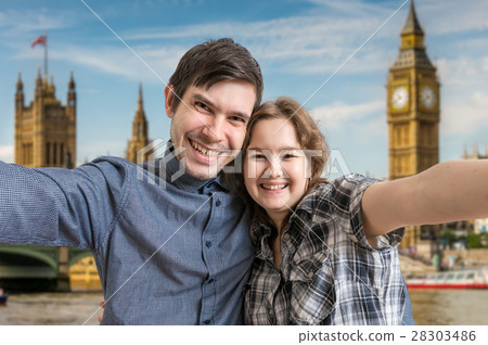 Selfie of cheerful couple travelling in London 28303486