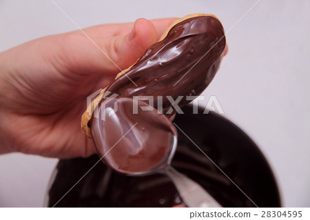 Eclairs or profiterole with chocolate and whipped Eclairs or profiterole with chocolate and whipped 28304595