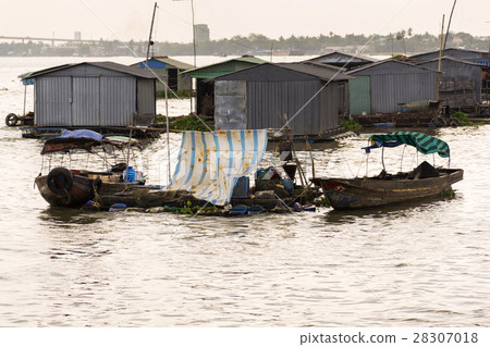 Fish farm houses floating on Mekong river, Vietnam Fish farm houses floating on Mekong river, Vietnam 28307018