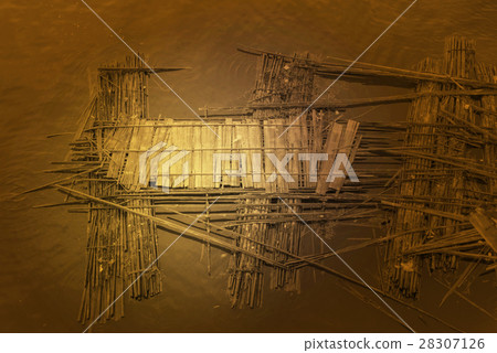 Old bamboo raft is floating on the river Old bamboo raft is floating on the river 28307126
