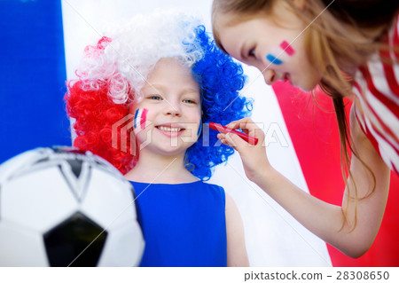Two funny little sisters supporting and cheering their national football team 28308650