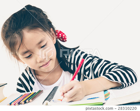 Vintage style photo of a girl is coloring a book Vintage style photo of a girl is coloring a book 28310220