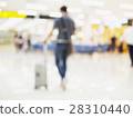 Blurred photo of walking traveler in airport 28310440