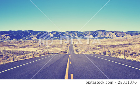 Vintage toned desert asphalt road. Vintage toned desert asphalt road. 28311370