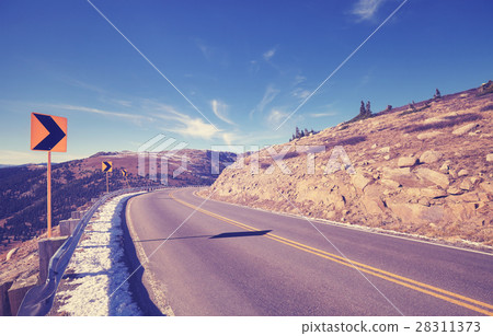 Vintage toned mountain asphalt road turn. 28311373