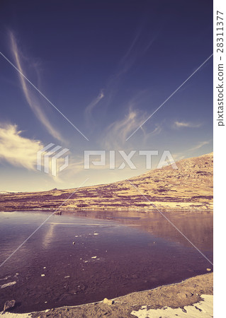 Color toned Independence Pass mountain lake. 28311377