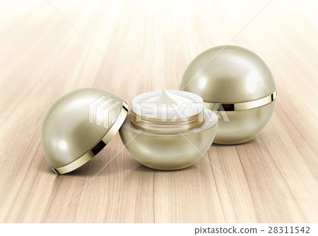 Golden sphere cosmetic jar on wood background 28311542