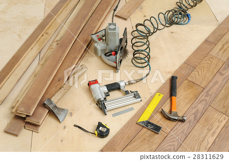 Installing a wooden floor. 28311629