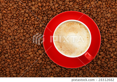 Full latte in red cup with saucer on coffee beans Full latte in red cup with saucer on coffee beans 28312682