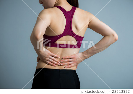 Young twenties lady with low back pain 28313552
