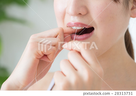 Women in their twenties using dental floss 28313731