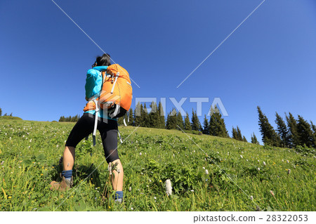 young woman hiker hiking in beautiful mountains young woman hiker hiking in beautiful mountains 28322053