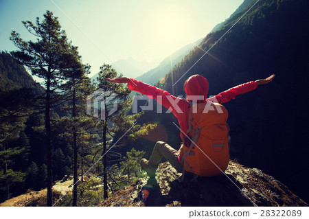 hiker open arms to sunrise on himalaya mountains hiker open arms to sunrise on himalaya mountains 28322089