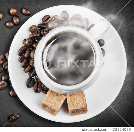 hot coffee on a table on a background black 28324050